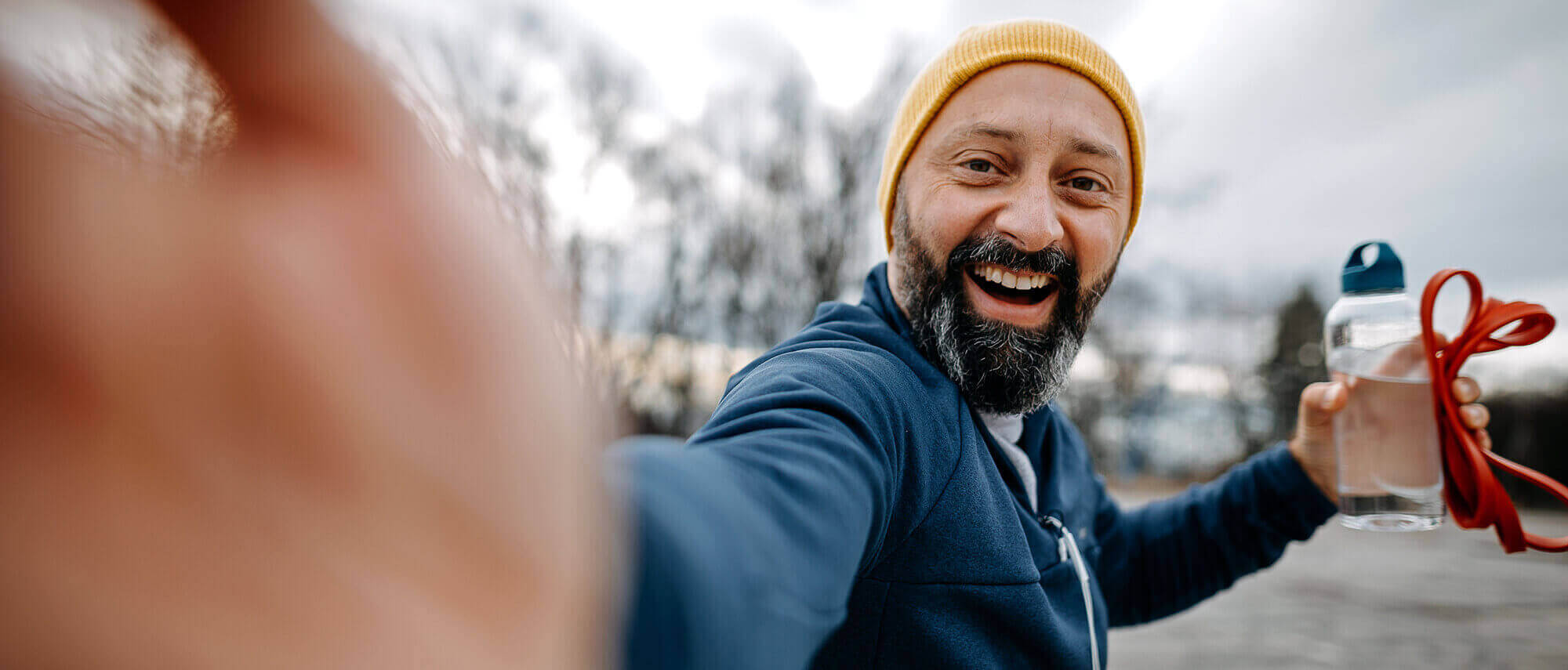 Man taking selfie with water