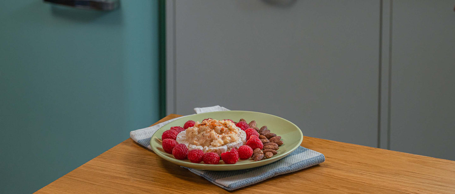 Seasoned chicken, rice cake, raspberries, and almonds