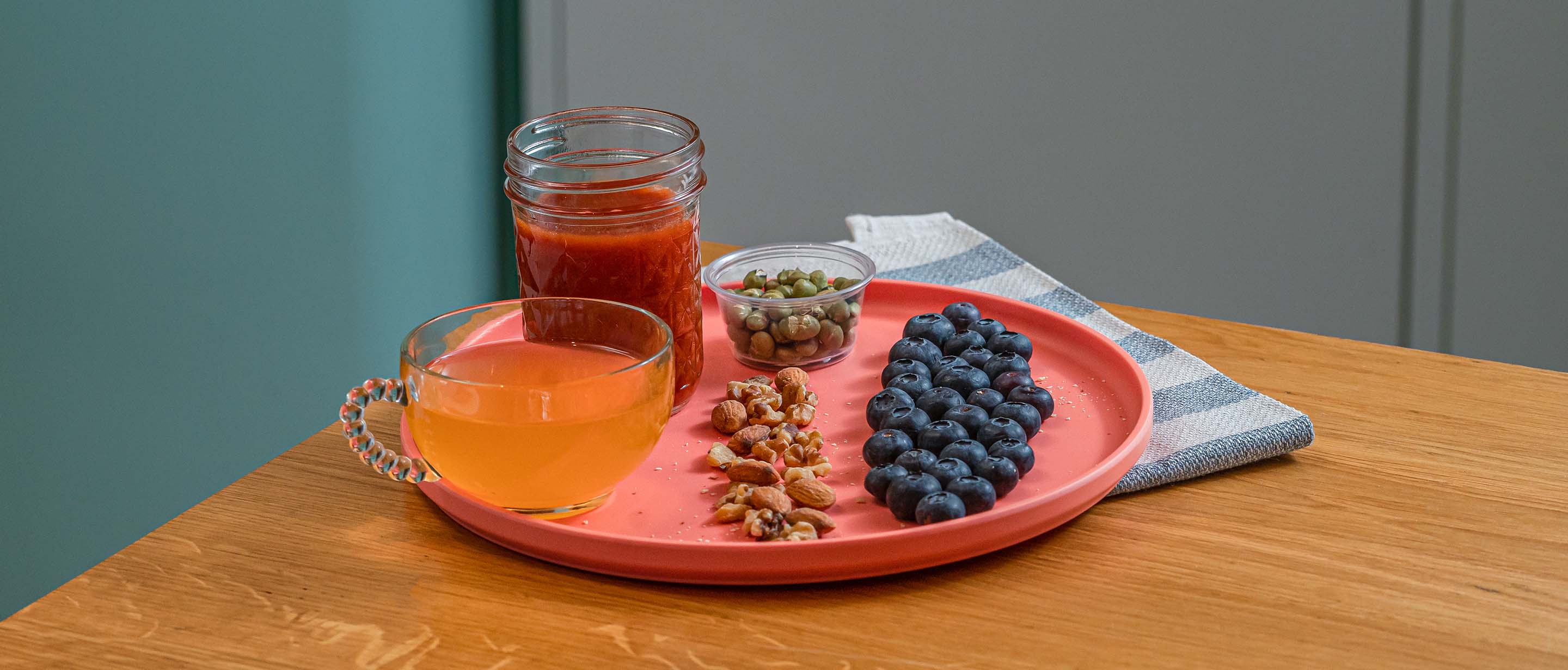 Vegetarian broth and roasted edamame, almonds and walnuts, and blueberries