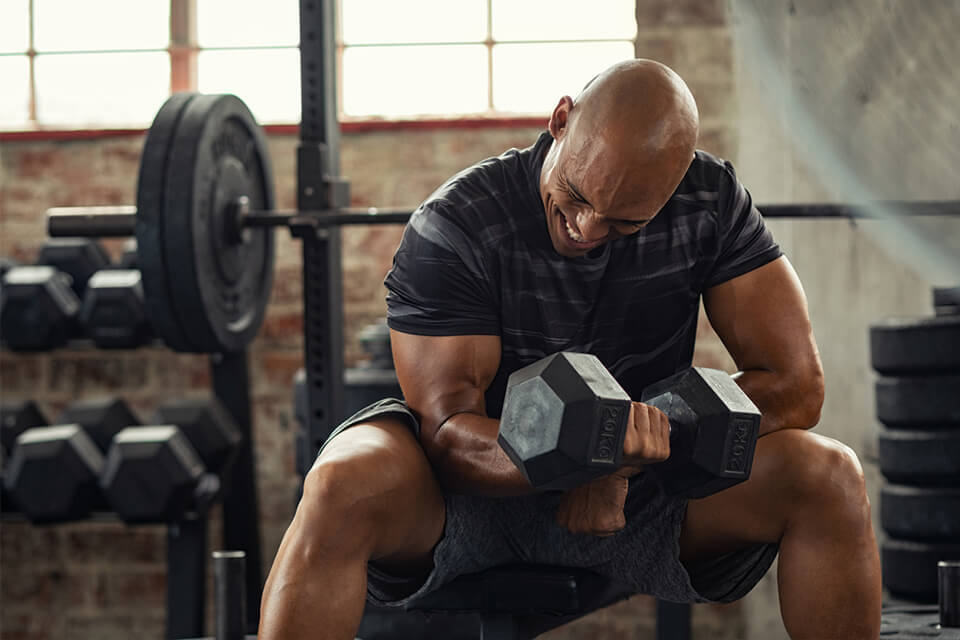 Man lifting weights in the gym